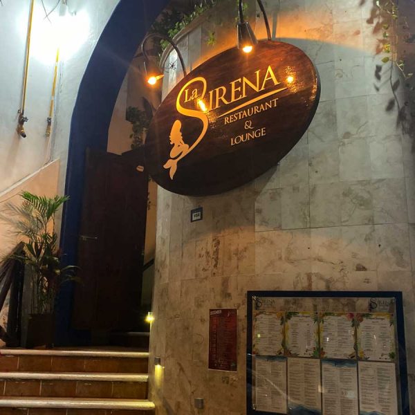 winding stone step lead up to the restaurant enterance. A menu hangs on the wall